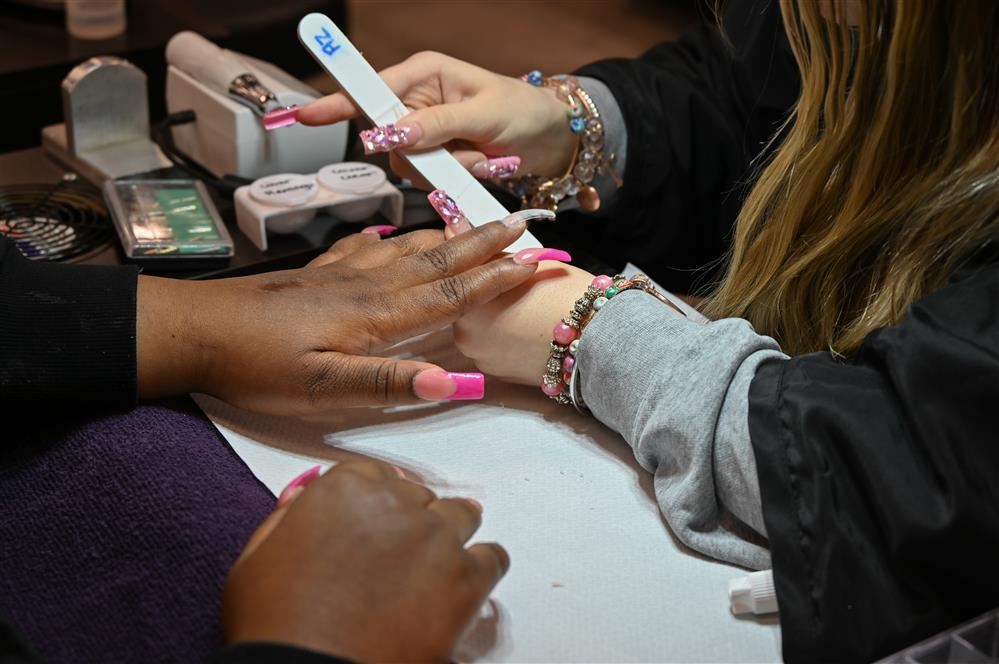 EMCC student filing a client's nail EMCC student filing a client's nail